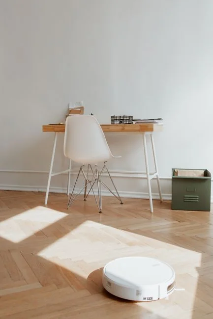 A couple working together to carry a couch while settling into a new apartment.